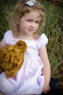 A friend of mine took these great birthday shots of Amelie. Here she is with one of her favorite teddy bears.