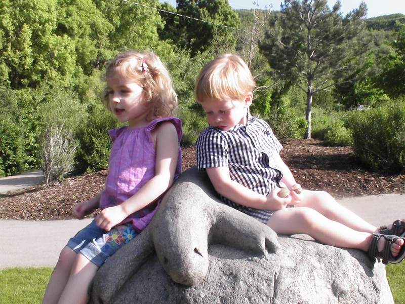 Just hanging out on a rock with some kind of lizard carved into it. 