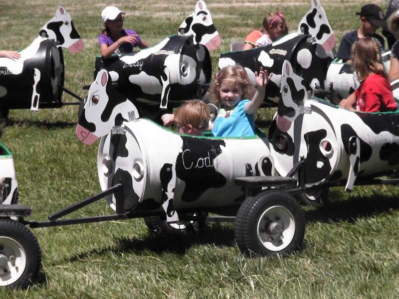 This was a special day at the farm and they had this great little cow train that the kids could ride. It was heaven for these two.