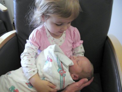 And his big sister and brother will hold him like this.