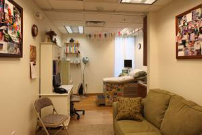 Where I have all of my prenatal visits. She has loads of toys that the kids love to play with in here.