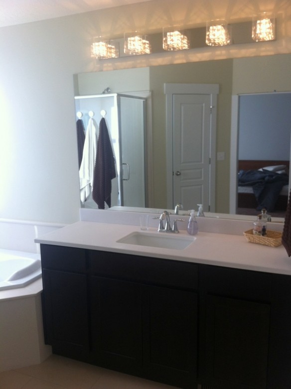 Our vanity. We picked out the funky lighting fixture and weren't sure how much we would like it. Once it was installed, any worries were replaced by how much we enjoy the piece and the unique shadows it casts. 