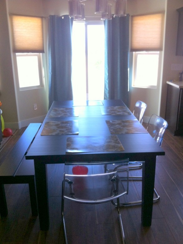 Facing the door and windows. 