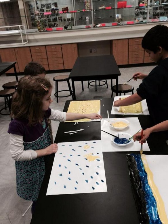 Working on painting designs on paper that they later used for collages during their study of Eric Carle books. 