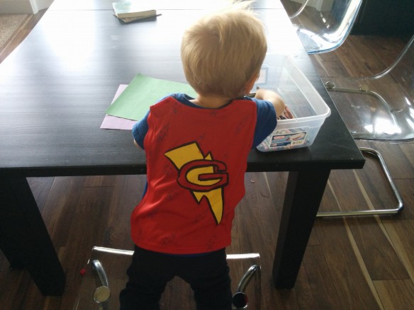 I mean, c'mon. It even has a cape! Whenever he puts in on, he sets off around the house saying, "vroooom!" with his arms straight out in front. 