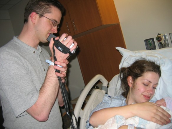 Taking a good look at our little man. Someday, Calder can point to this picture and say, "See? That's my dad using this weird thing called a camcorder. Weird, huh?" 